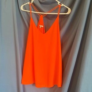 Orange non-see through tank top made with sheer-like material. Great for gameday